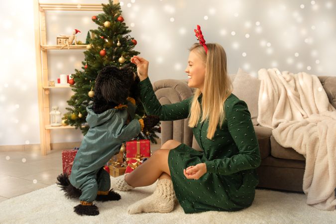 Concept of Merry Christmas, Young woman and Christmas dog