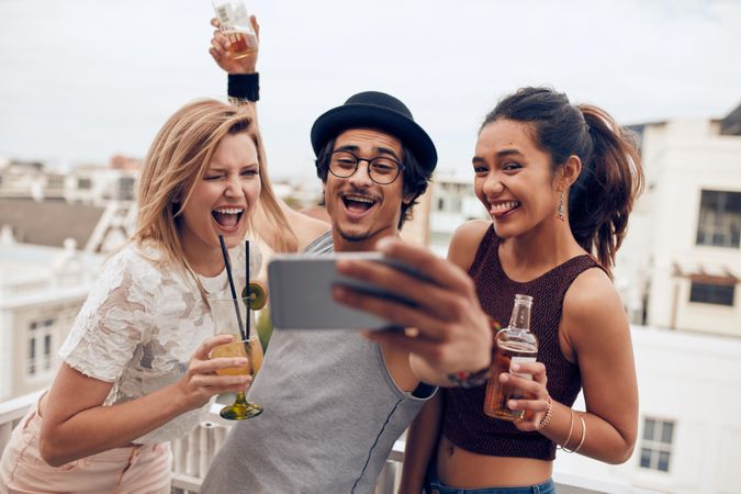 Small group of friends taking selfie on a mobile phone