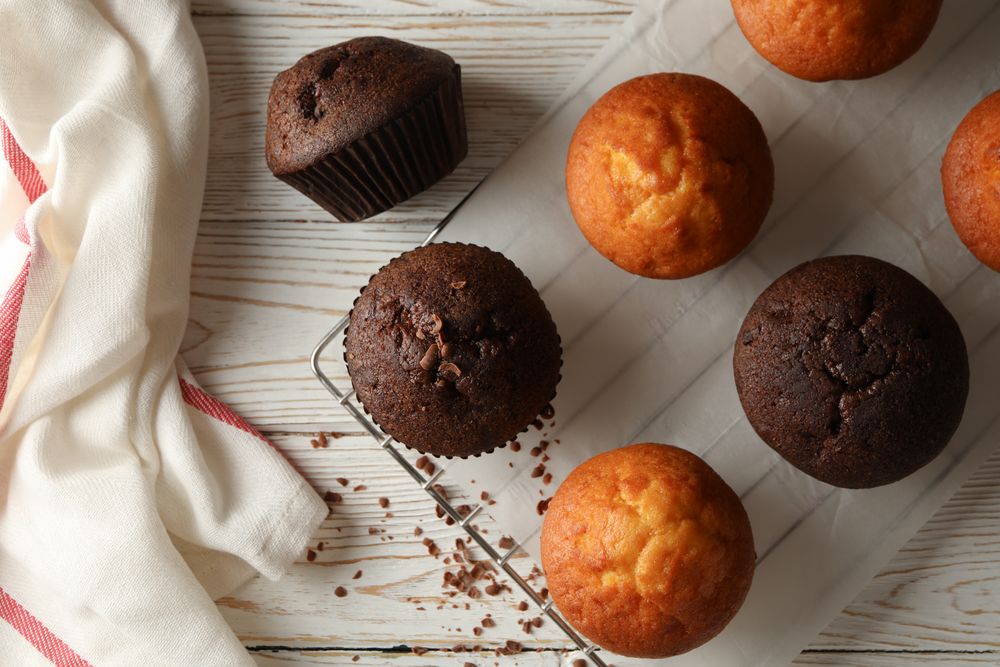 Composition with tasty muffins on wooden background
