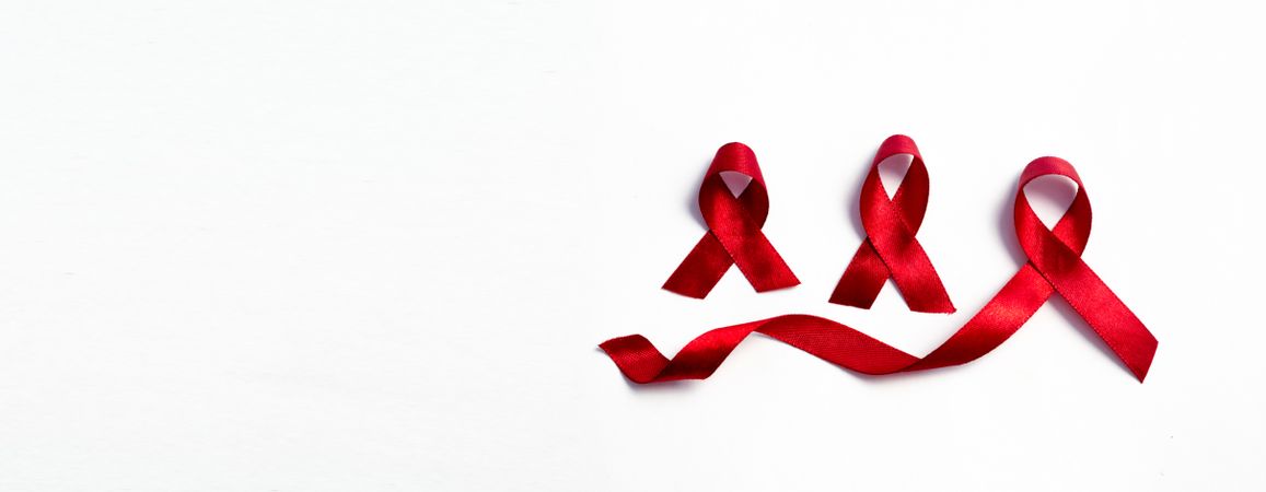 Red ribbons, HIV awareness concept, world AIDS day, world hypertension day, world cancer day with copy space