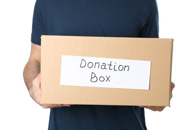Man hold donation box, isolated on plain background