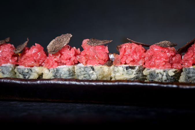 Delicious tempura sushi in row