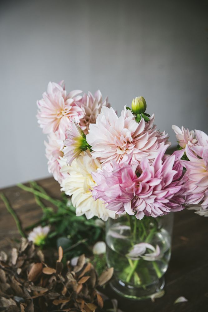 Bunch of flowers in vase on table
