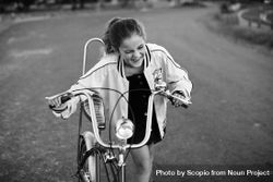 Grayscale photo of young girl riding bicycle beBo60