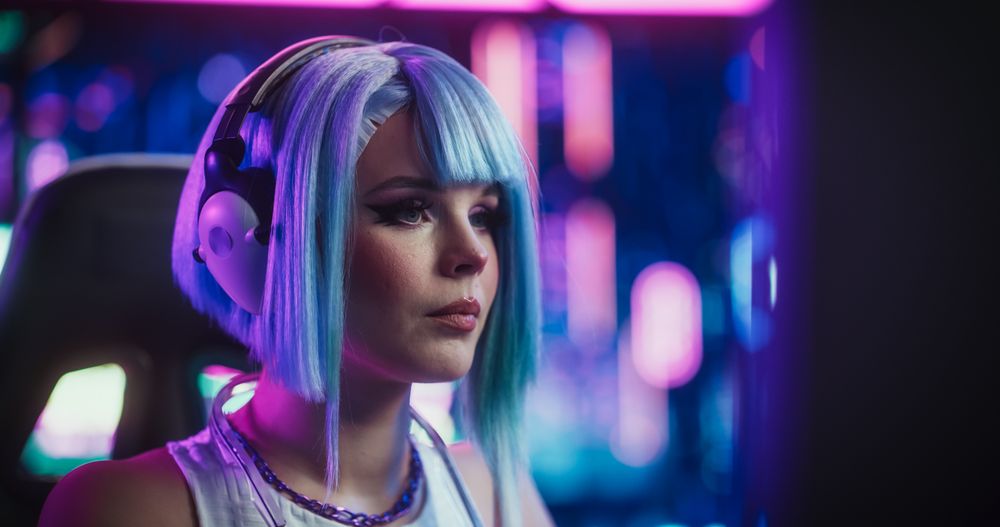 Close Up Portrait of a Young Female Wearing Headphones, Talking with Friends Online on a Computer.