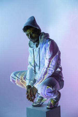 Stylish Black man on cube