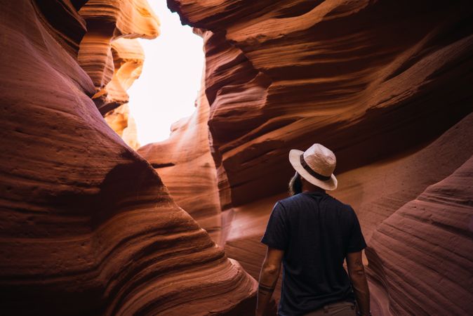 Bearded traveler looking at ravine walls