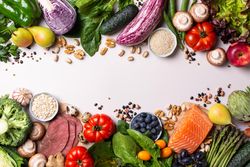 Assortment of healthy food ingredients for cooking, copy space in center of picture
