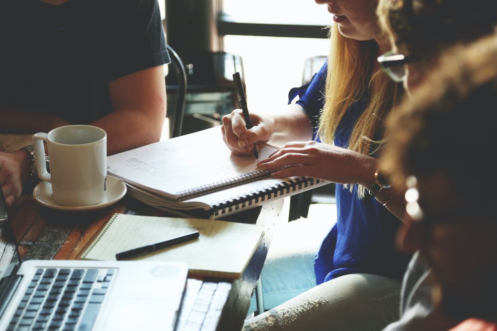 Cropped image of students studying together