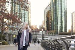 Happy woman walking in the city