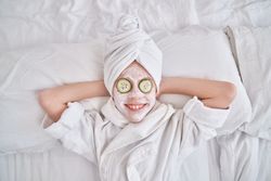 Cheerful kid on spa treatments