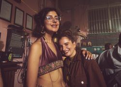 London, England, United Kingdom - Nov 9, 2022: Two smiling female friends at festival in London