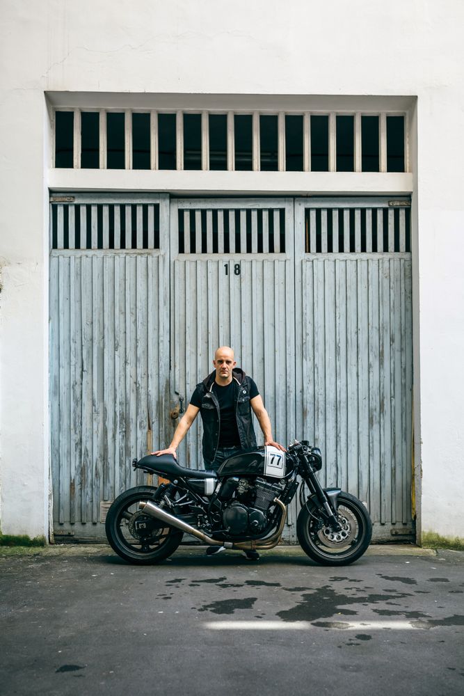 Builder posing with a motorcycle