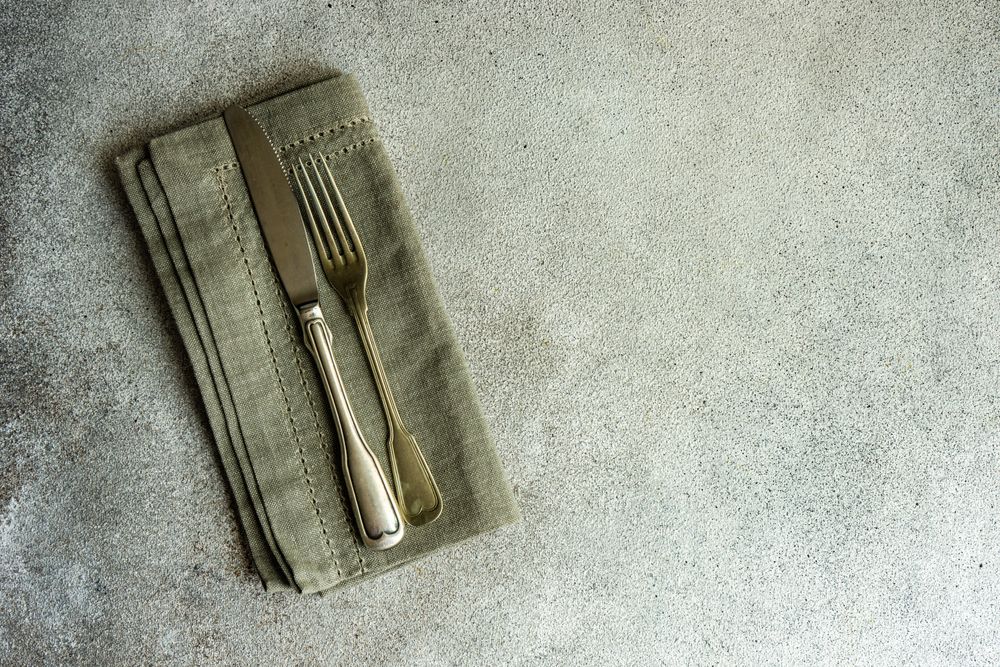 Overhead grey napkin with silverware
