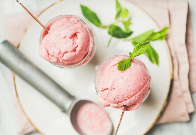 Homemade strawberry yogurt ice cream with fresh mint