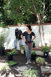 Female contractor contemplating next move in landscaping project