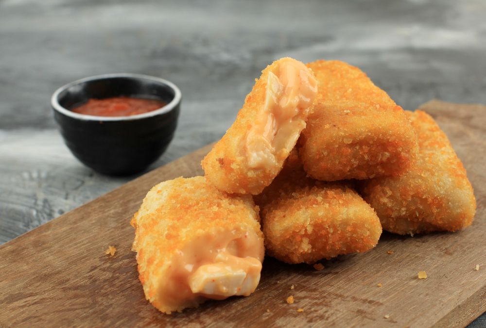 Pile of risol mayo keju, thin crepes rolled with egg and mayonnaise filling