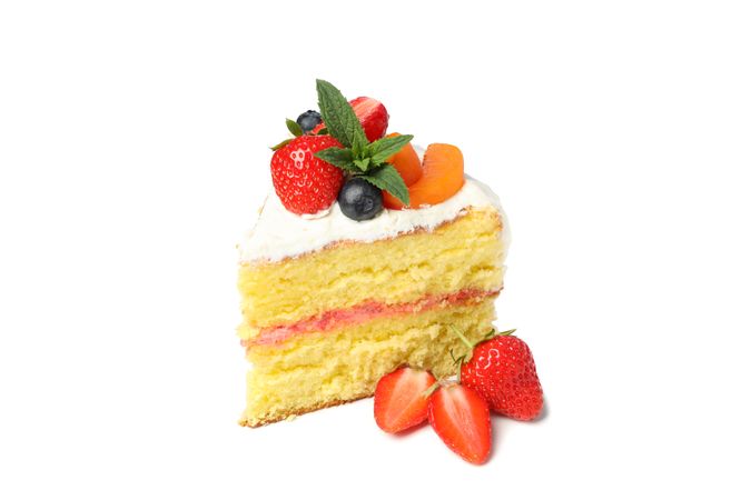 Piece of berry cream cake isolated on blank background