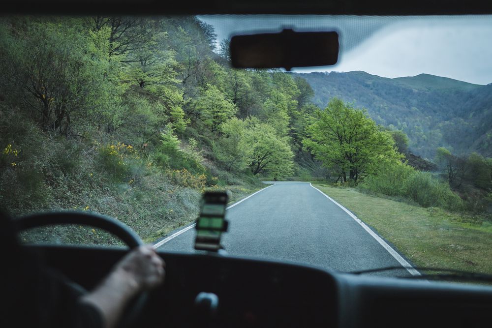 View of inside car empty road in countryside