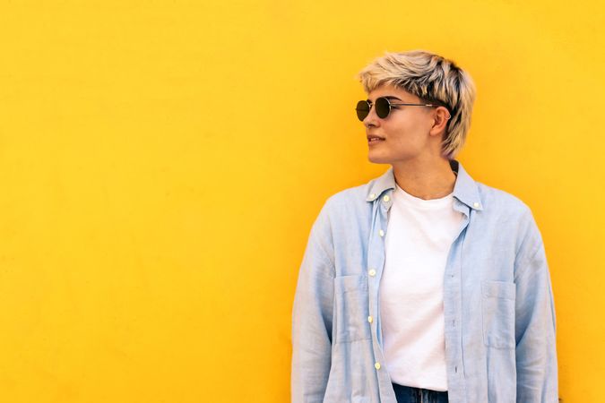 stylish young woman with short hair, sunglasses, portrait