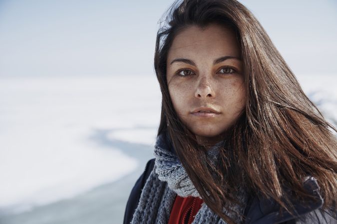Young adult woman outdoors in icy landscape
