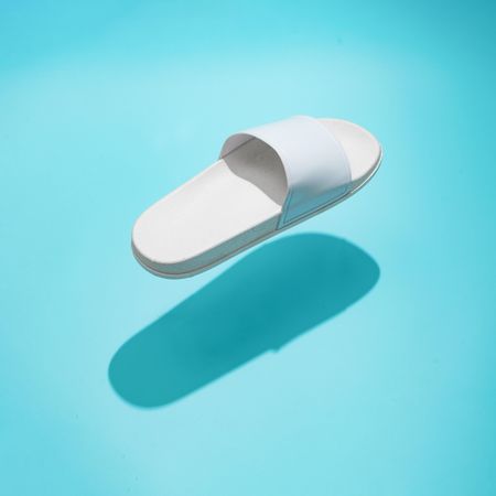 Flip flop on bright blue background