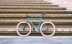 Bicycle leaned against steps outside