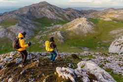 mountaineers hiking on a mountain peak