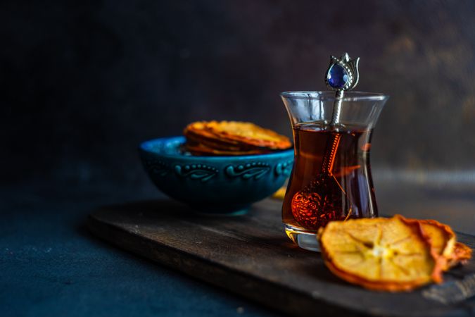 Dried persimmon slices surrounding Turkish tea