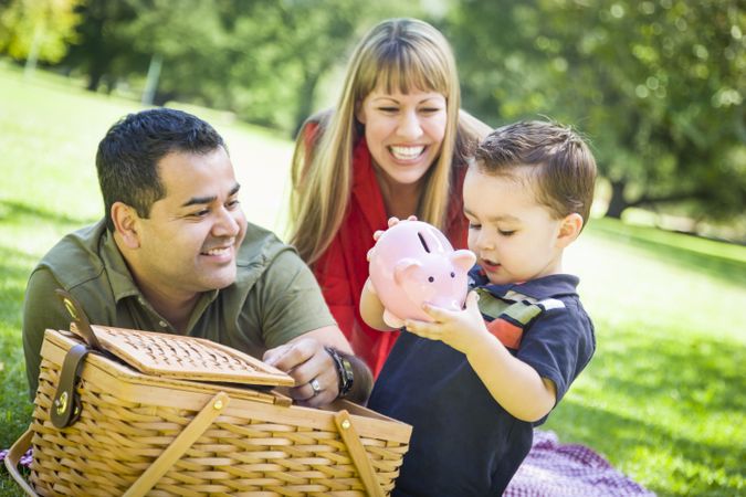 Couple Give Their Son a Piggy Bank at the Park