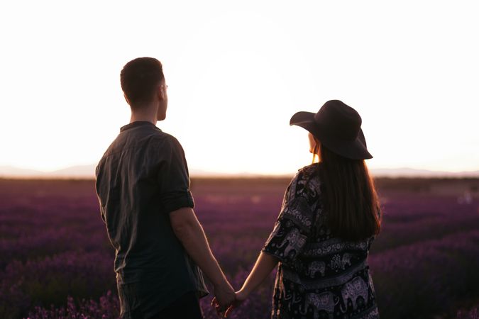 Young couple on a romantic date in a lavender field.