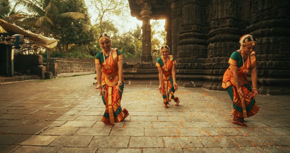 Portrait of an Energetic Indian Woman in Traditional Attire Dancing Bharatanatyam with Expressive Face and Swift Moves.
