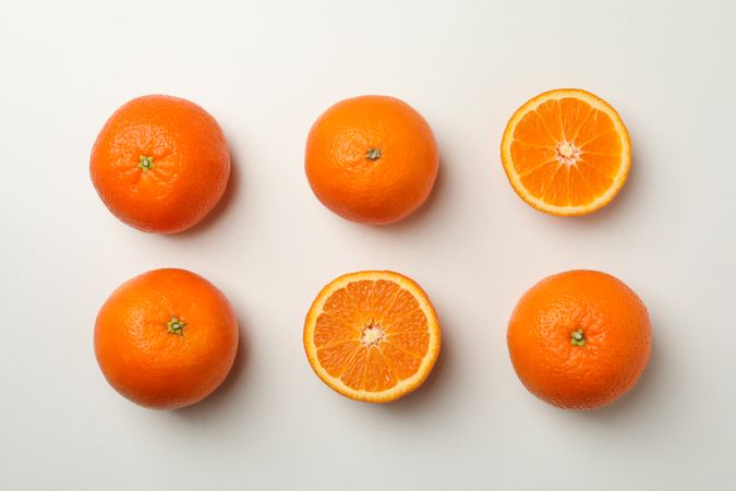Flat lay with ripe mandarins on light background