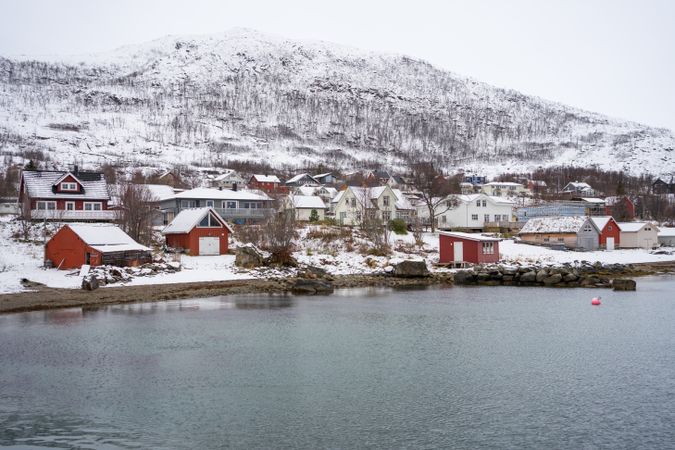 Picturesque town in calm lake in winter