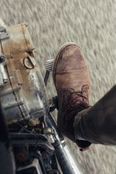 Crop leg on motorcycle pedal