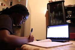 School girl learning online at home