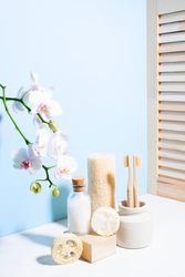 Set of natural personal care products for zero waste lifestyle against blue wall