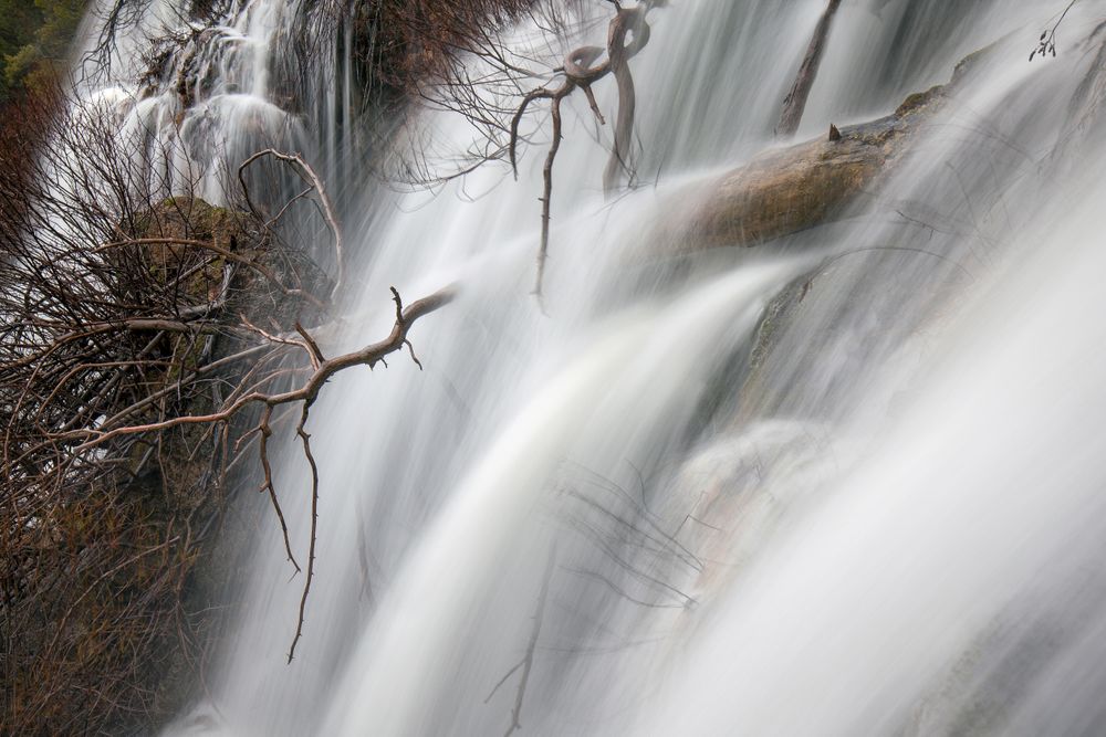 Wonderful waterfall near tree