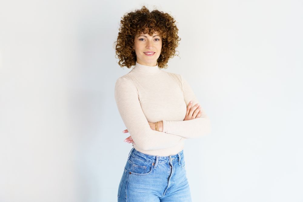 Confident woman in casual clothes with arms crossed