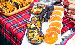 Christmas food concept of florentines and chocolate dipped orange slices