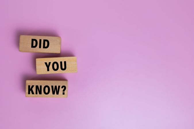did you know words on wooden blocks isolated on pink background. copy space