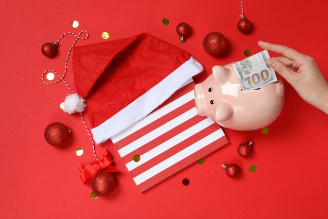 Concept of Christmas finance with piggy bank, top view