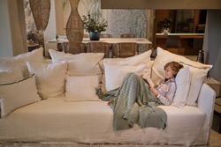 Boy reading book in living room