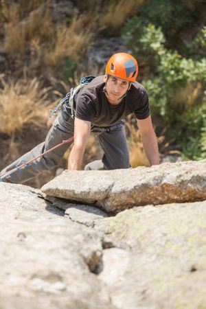 Man climbing a rock