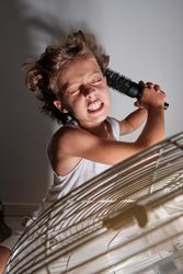 Adorable preteen boy pretending to sing with hairbrush