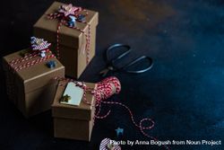 Three brown Christmas gifts with red string with copy space 4dnqN0