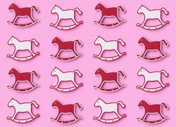 Rocking horse ornaments on pink background