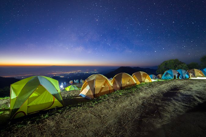 Starry night sky with tent at Monson viewpoint Doi AngKhang and milky way galaxy with stars and space dust in the universe