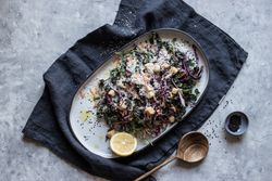 Poppy seeds and lemon near vegetable salad with croutons and parmesan