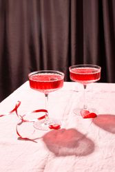 Side view of crystal champagne glasses with heart